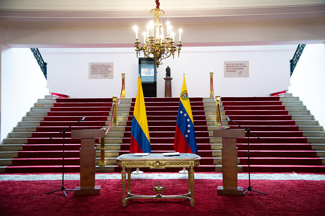 Colombia's flag and Venezuela's flag moments before a joint declaration on cooperation in the search for persons reported missing on the Venezuelan border, in Bogota, Colombia on June 30, 2023.