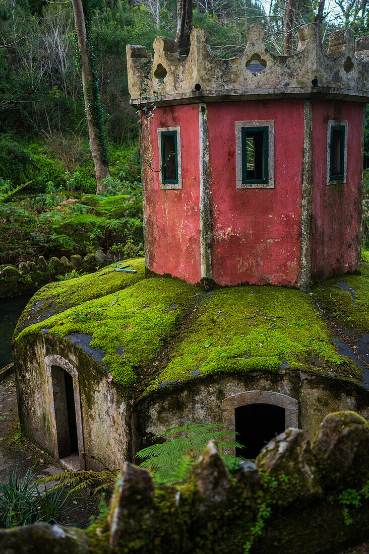 Ancient duck house resembling a tower at Valley of Lakes and Little Birds Fountain at Park and National Palace of Pena (Palacio de la Pena), Sintra, Portugal