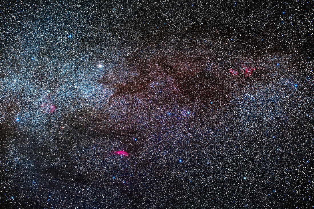 The Milky Way through the Perseus to Auriga area, populated by clusters and nebulas of the next spiral arm out from ours, in the Perseus Arm. The Double Cluster is at right, with the Heart and Soul Nebulas above it, while the Auriga clusters and nebulas are at left. At bottom is the California Nebula and Messier 34 cluster. The Perseus OB Association of hot blue stars is at centre. Capella is the bright star at upper left. The Taurus Dark Clouds are at lower left.