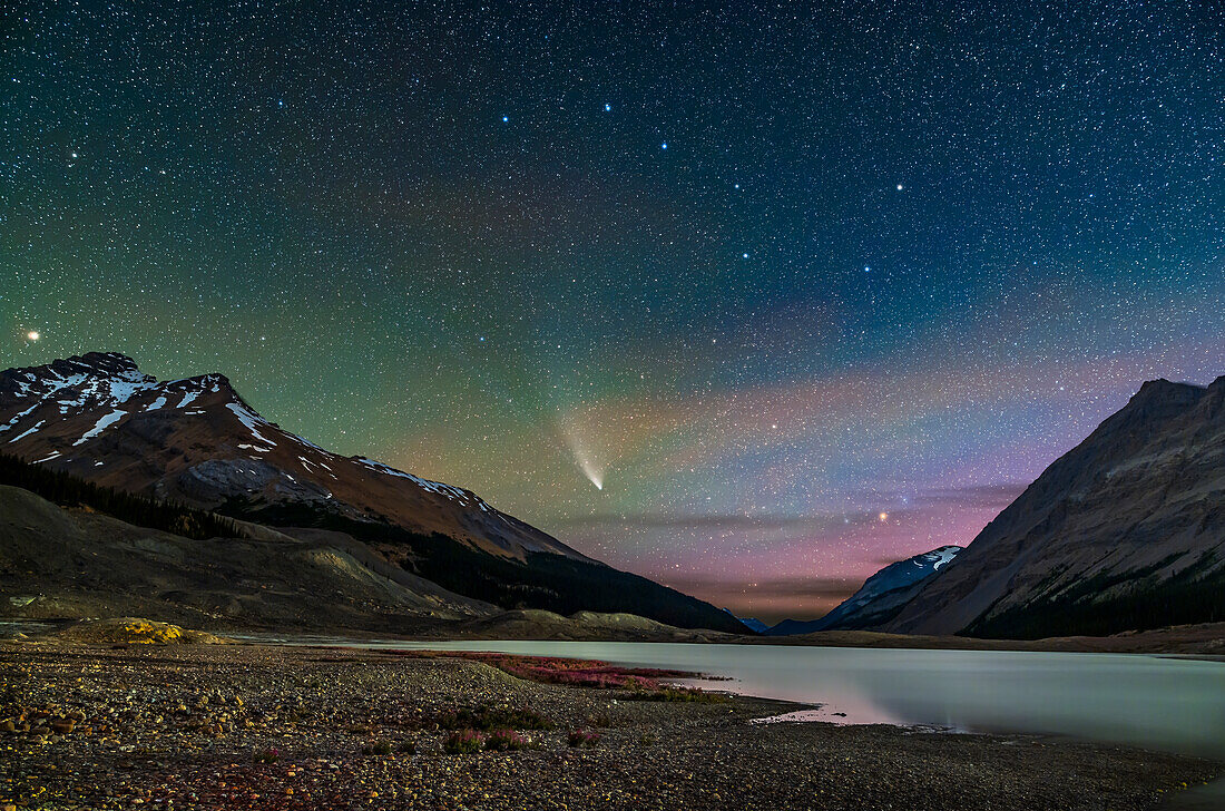 Comet NEOWISE (C/2020 F3) on July 27, 2020 from the Columbia Icefields (Jasper National Park, Alberta) from the Toe of the Glacier parking lot, looking north over Sunwapta Lake, formed by the summer meltwater of Athabasca Glacier. So this is a portrait of ice in the sky and icy water on Earth.