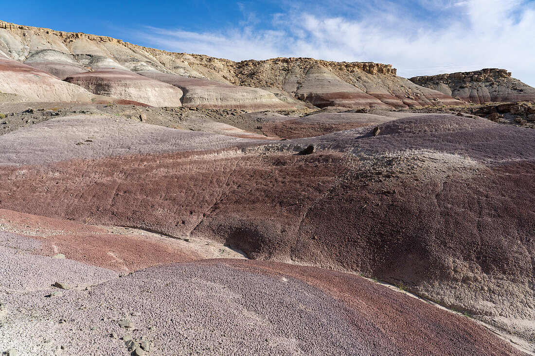 Eroded formations in the colorful bentonite clay hills of the Morrison Formation in the Caineville Desert near Hanksville, Utah.