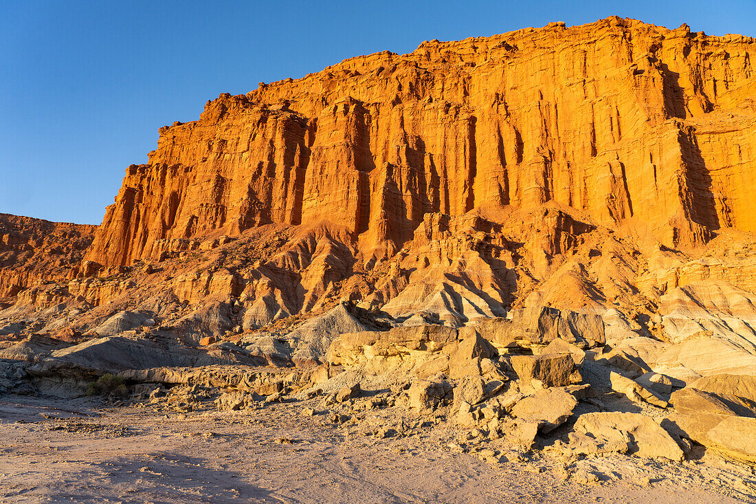 Colorful red sandstone cliffs at sunset in Ischigualasto Provincial Park, San Juan Province, Argentina.