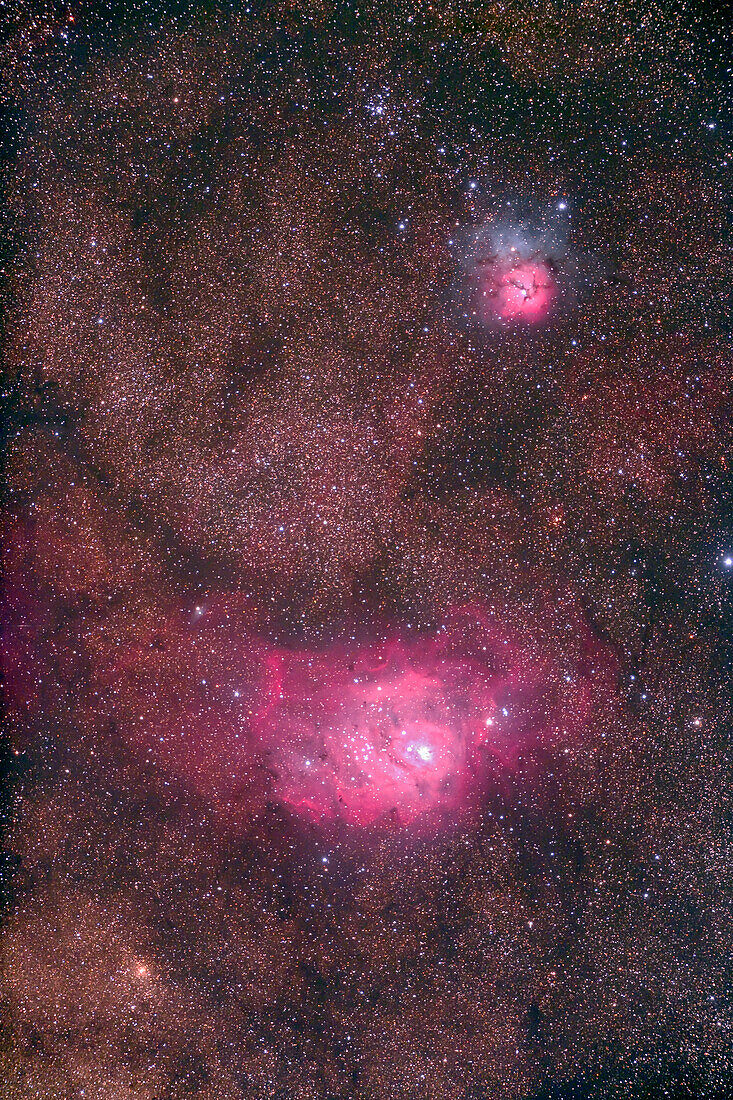 M8 Lagoon Nebula and M20 Trifid Nebula, with Astro-Physics Traveler 4-inch apo refractor at f/6 with Canon 5D camera, for 7 minutes each at ISO800. Stack of four exposures. Taken from Coonabarabran, NSW, Australia, July 2006. Slight trailing and soft focus.