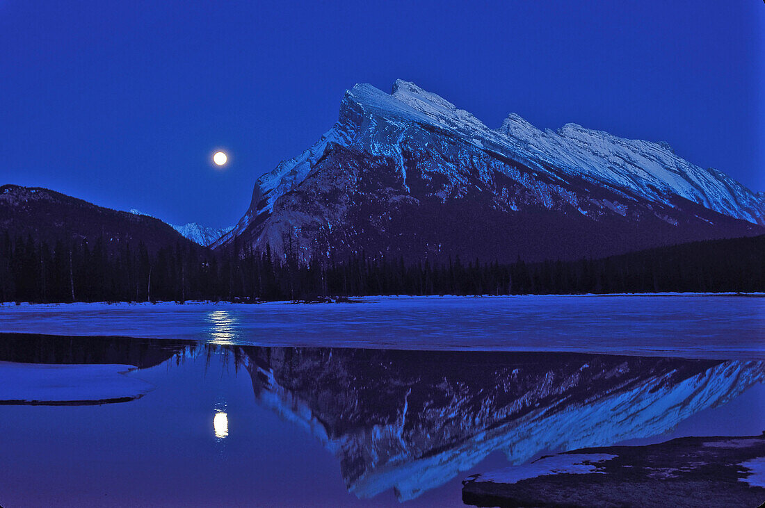 Full Moon rising at fall equinox, over Vermilion Lakes, and beside Mt. Rundle, Banff National Park, September 1995.