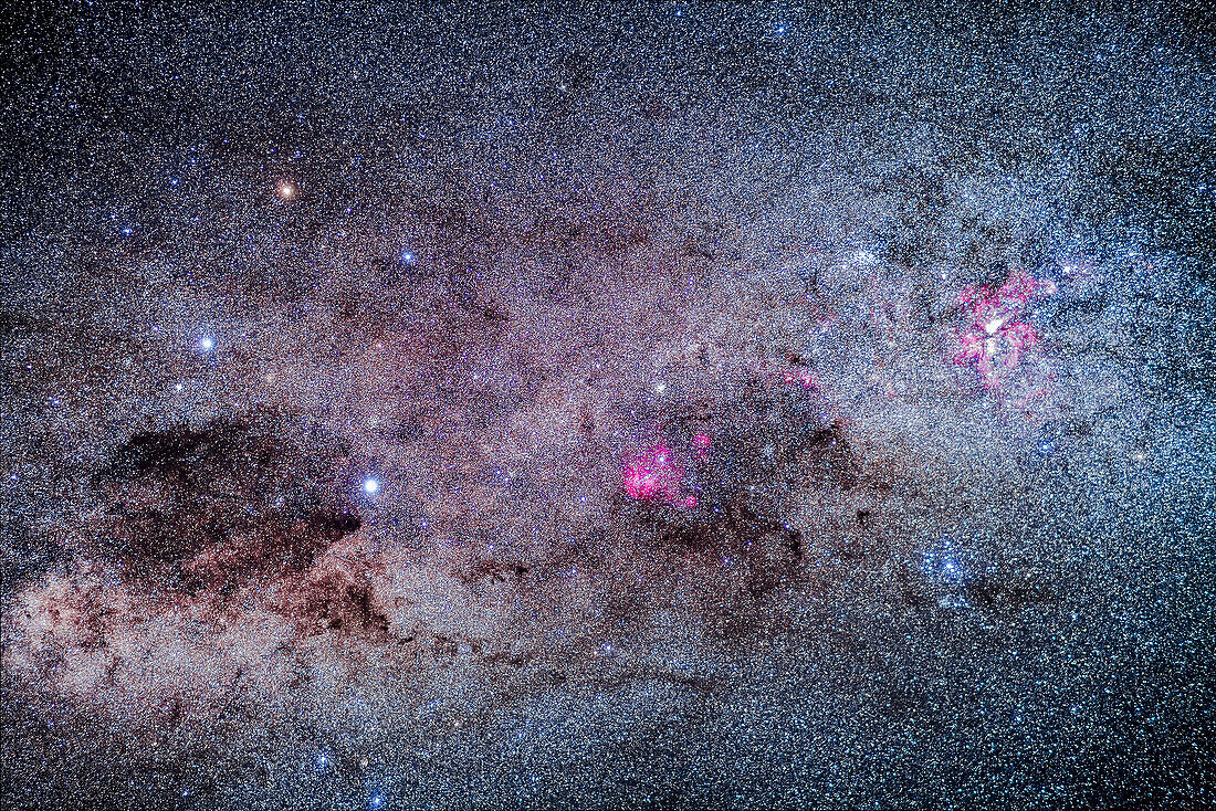 The amazing area of the southern Milky Way in Carina and Crux, the brightest part of the Milky Way after the galactic core region. At right is the Carina Nebula, with the Southern Pleiades cluster, IC 2602, below it. The Football Cluster, NGC 3532, is at upper left of the Carina Nebula. At centre is the region of Lambda Centauri, with the star cluster NGC 3766, the Pearl Cluster, above the emission nebulosity. At left is the Southern Cross, with the dark Coal Sack at bottom left of the Cross, with thin tendrils extending to the right. To the left of Alpha Cruxis at the bottom of the Cross is t