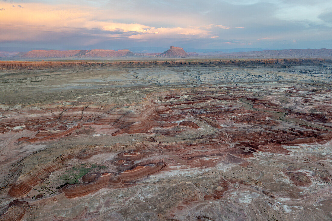Aerial view of the colorful Bentonite Hills and Factory Butte before dawn, near Hanksville, Utah.