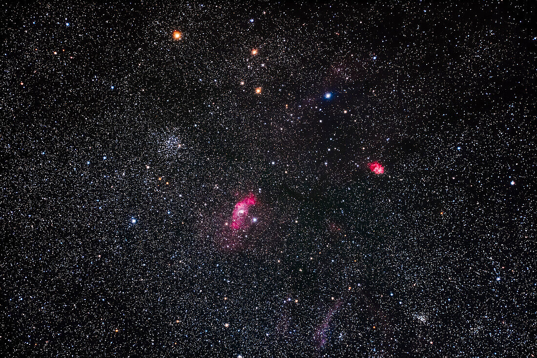 Messier 52 open cluster, at left, and the Bubble Nebula, NGC 7635 below and to the right of it, at centre, plus the small red nebula NGC 7538 at right. The open cluster at lower right is NGC 7510. All in Cassiopeia.