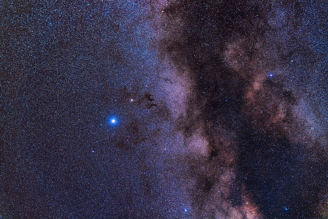 A framing of northern Aquila and the Milky Way near Altair, the bright blue-white star at left. Above is yellowish Tarazed, below is dimmer Alshain. To the right of Tarazed are the dark nebulas Barnard 142 and 143, aka Barnard's E.