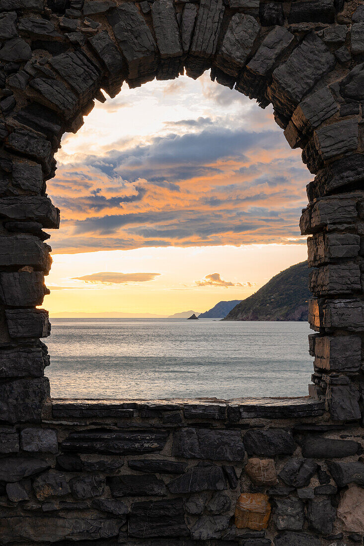 Beautiful sunset view of the Ligurian coast, viewed from the rock window of Portovenere village, La Spezia province, Liguria district, Italy, Europe