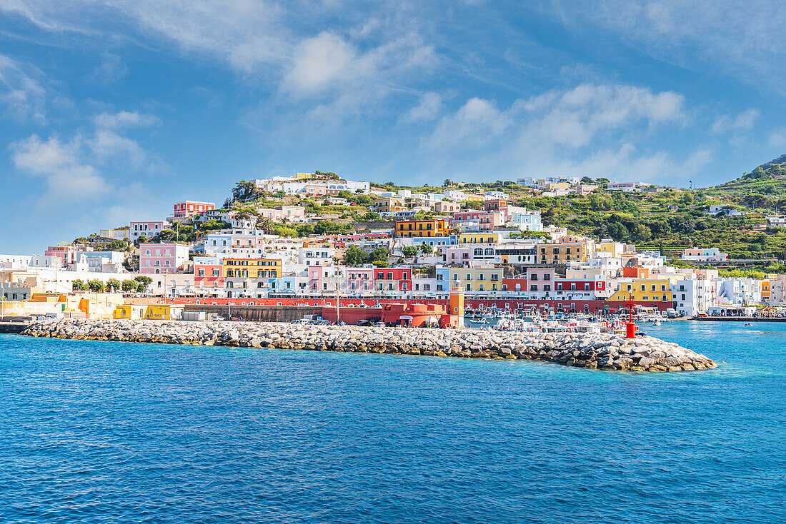 Colourful buildings surrounding the harbour of the fishing village of Ponza on a summer day, Ponza island, Pontine Islands, Latina province, Latium (Lazio), Italy, Europe
