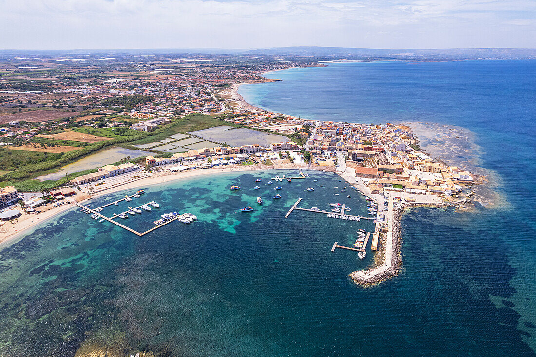 Aerial drone shot of the fishing village of Marzamemi in blue water, Marzamemi, Pachino municipality, Siracusa province, Sicily, Italy, Mediterranean, Europe