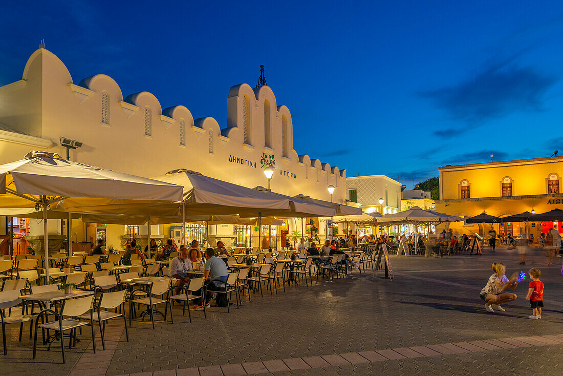 View of Kos Municipal Market in Eleftherias Central Square in Kos Town at dusk, Kos, Dodecanese, Greek Islands, Greece, Europe