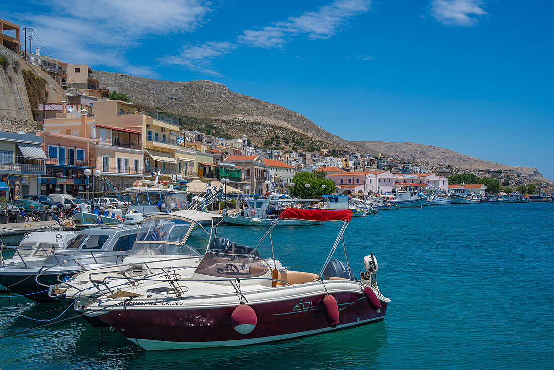 View of harbour boats in Kalimnos with hills in the background, Kalimnos, Dodecanese Islands, Greek Islands, Greece, Europe