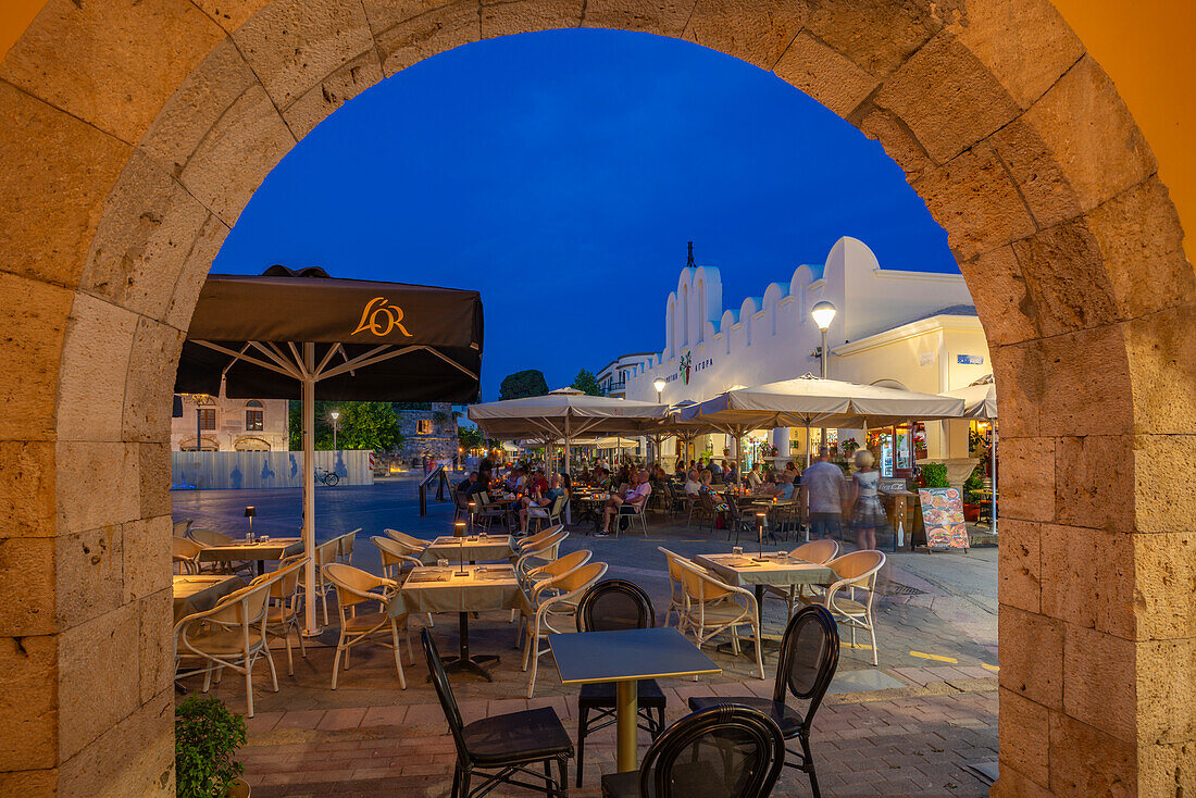 View of Kos Municipal Market in Eleftherias Central Square in Kos Town at dusk, Kos, Dodecanese, Greek Islands, Greece, Europe