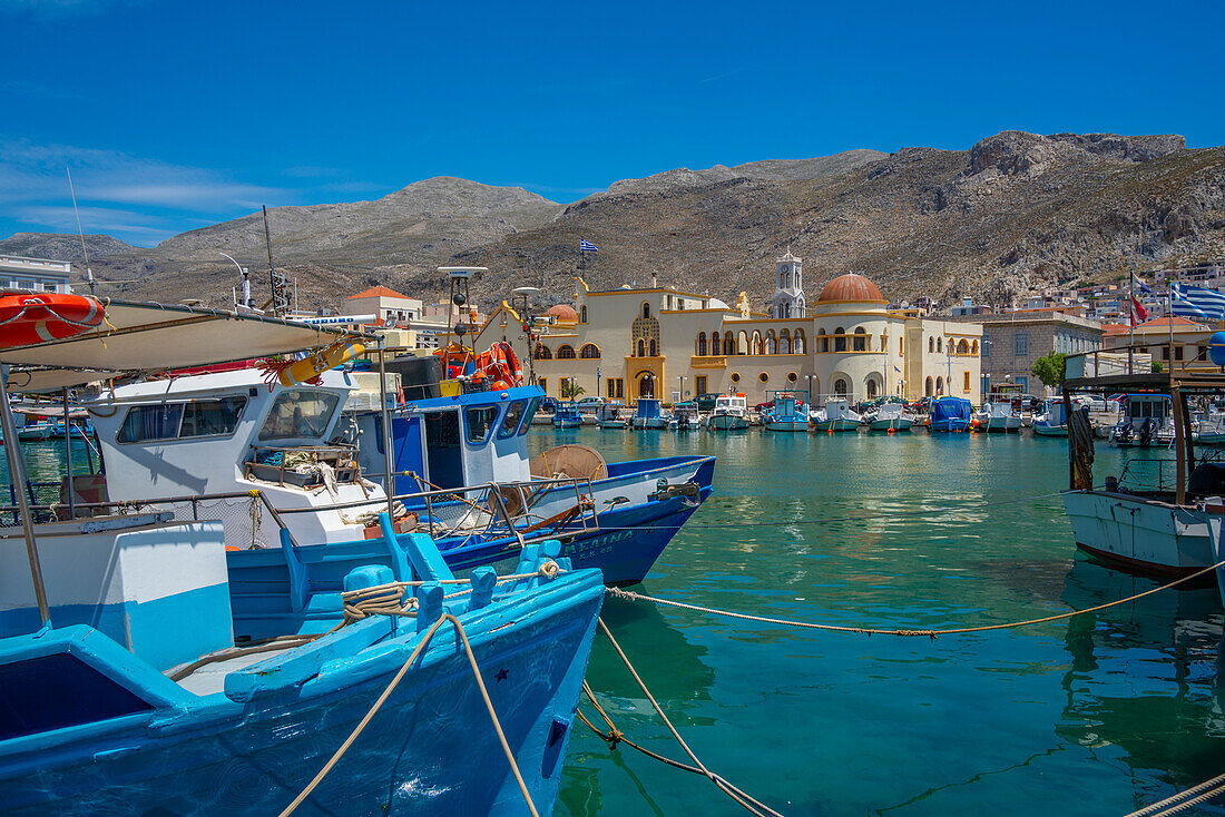 View of harbour boats in Kalimnos with hills in the background, Kalimnos, Dodecanese Islands, Greek Islands, Greece, Europe