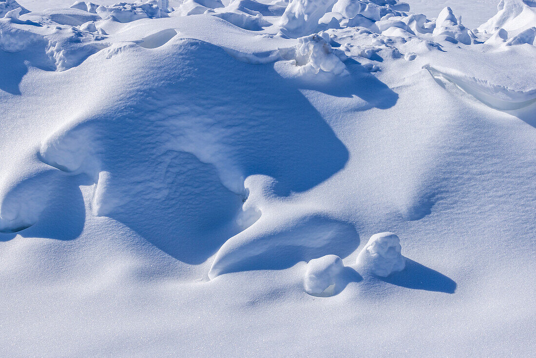 Close-up of sheet of snow at sunny day