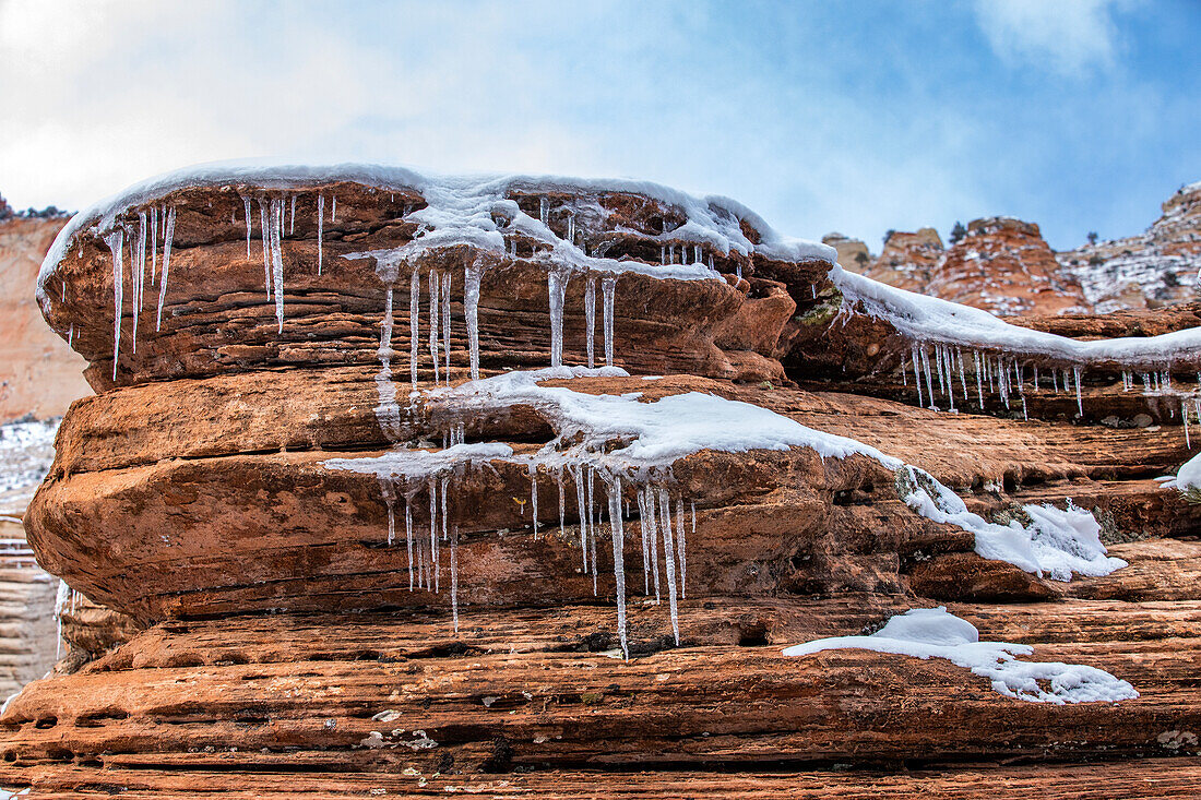 USA, Utah, Springdale, Zion National Park, Icicles hanging from rock in mountains
