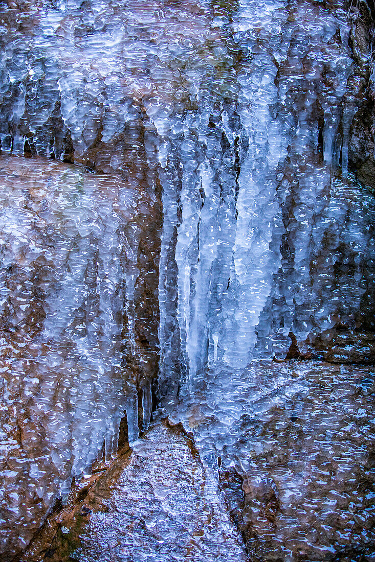 Close-up of textured ice on rock surface