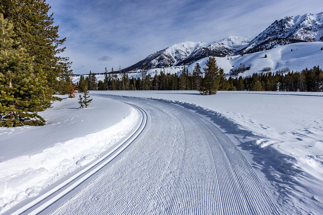 USA, Idaho, Sun Valley, Snow-covered mountains with dirt road