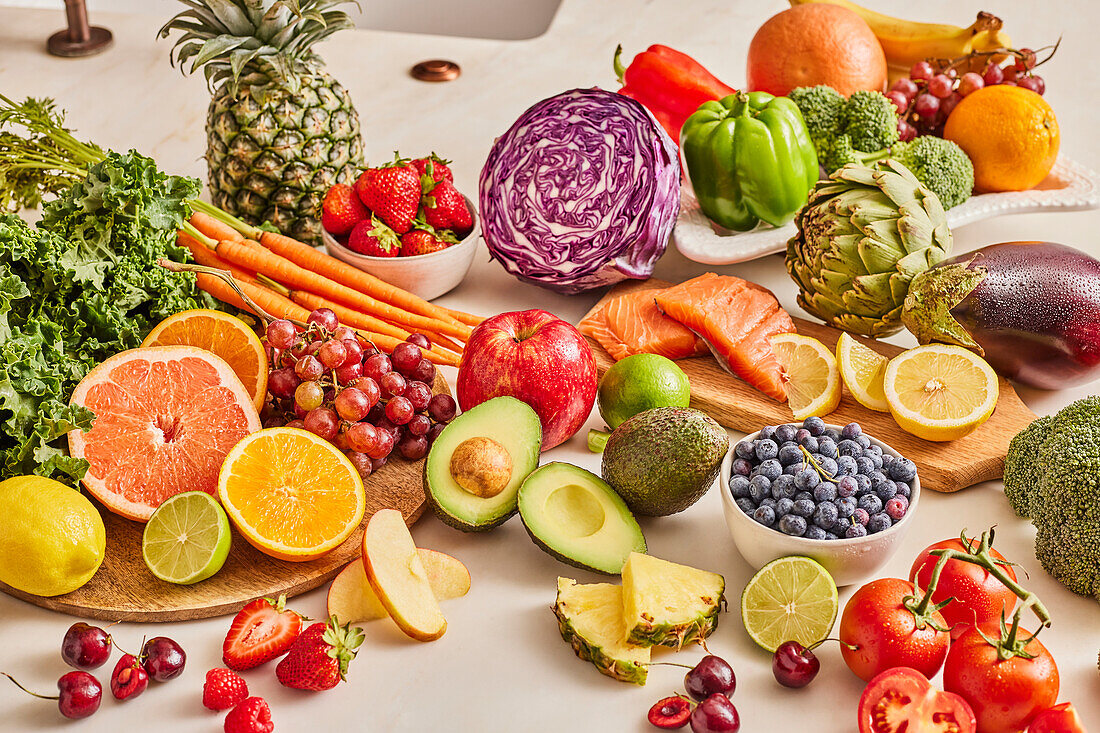 Assorted fresh fruit and vegetables in kitchen counter