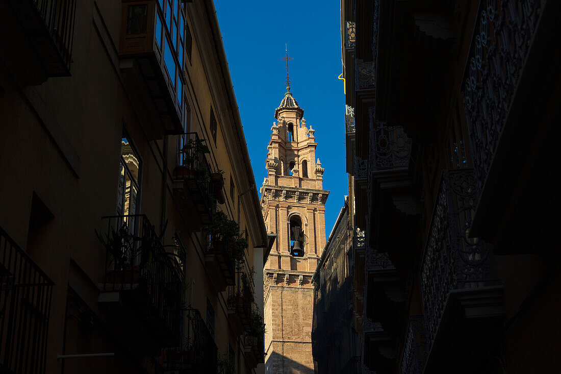 Spain, Valencia, Church bell tower and old town buildings