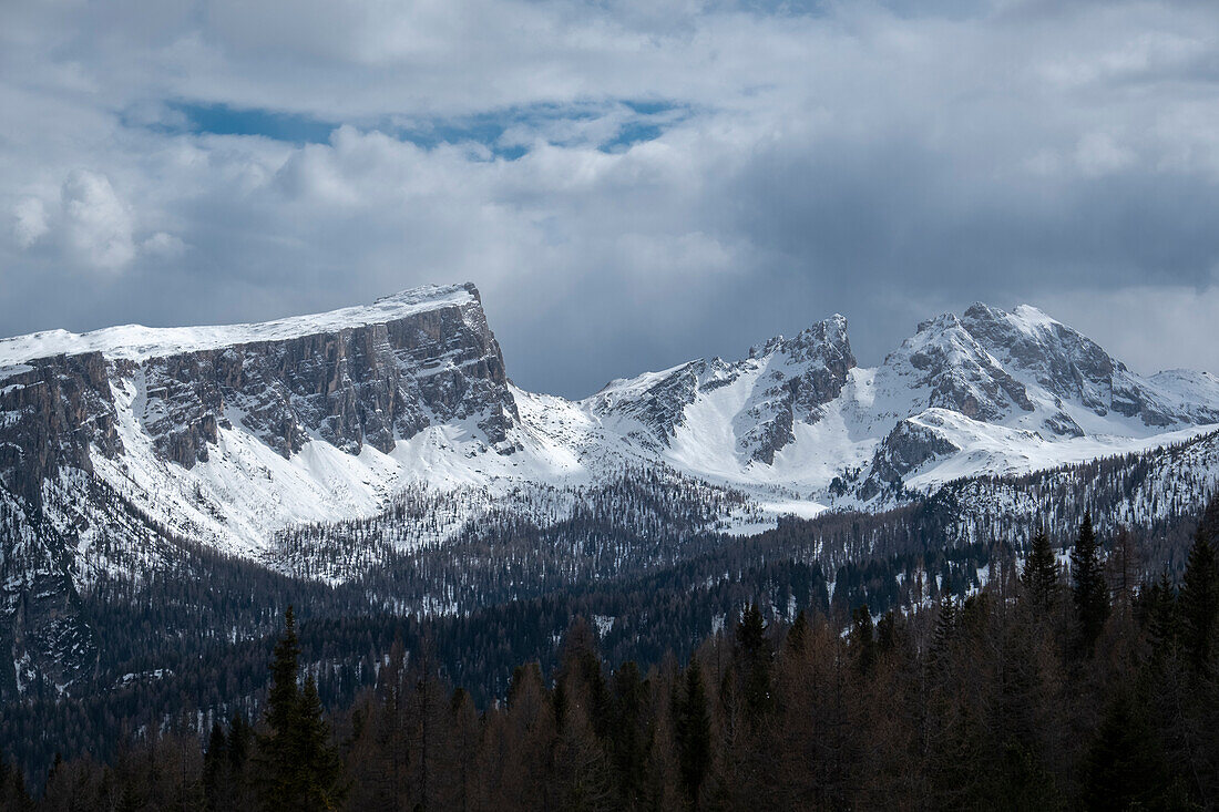 Dolomites of Cortina D'Ampezzo covered by snow on a sunny day with clouds, Belluno, Italy, Europe