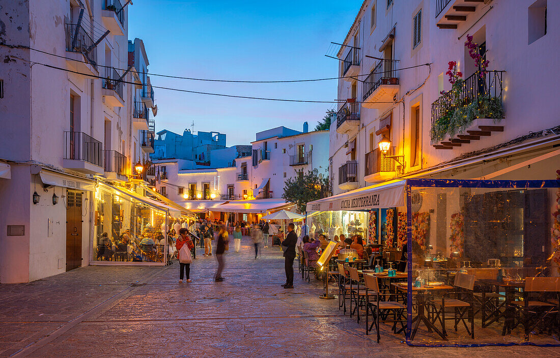 View of restaurants and bars in Dalt Vila at dusk, UNESCO World Heritage Site, Ibiza Town, Eivissa, Balearic Islands, Spain, Mediterranean, Europe