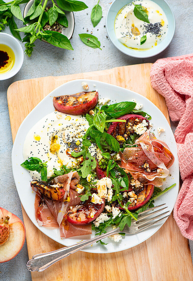 Grilled peach and prosciutto salad