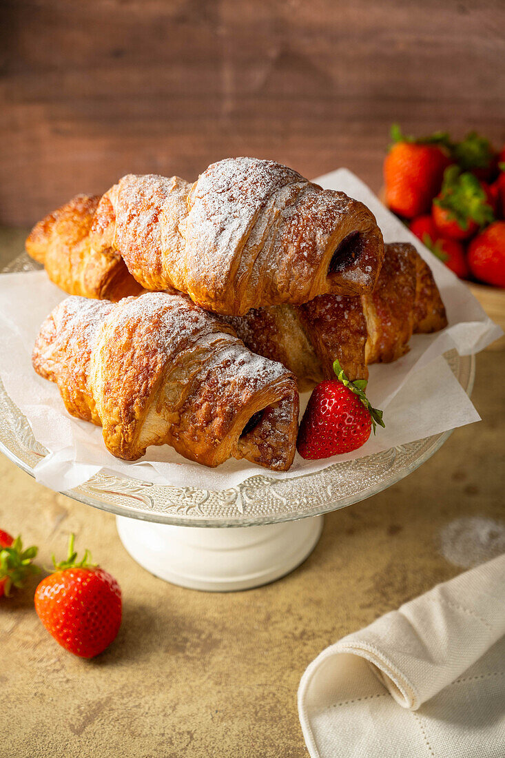 Classic French croissants with fresh strawberries