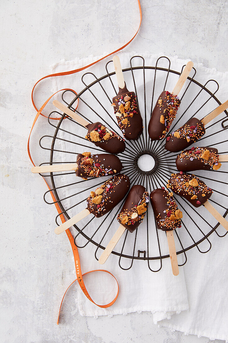 Chocolate dipped bananas on a stick