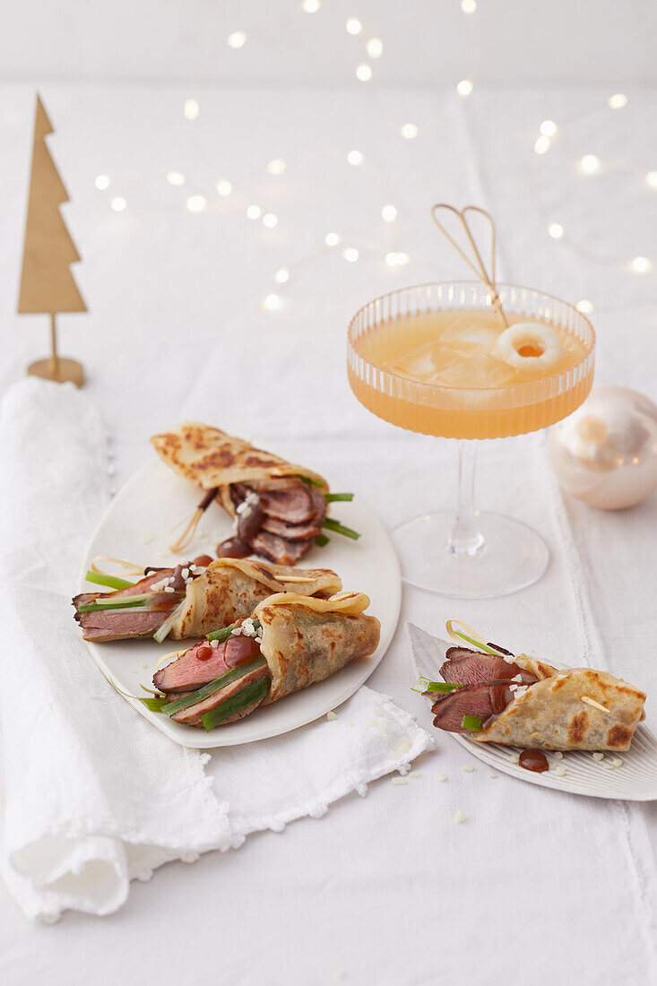 Chinese mini crepes with duck breast and lychee mai tai