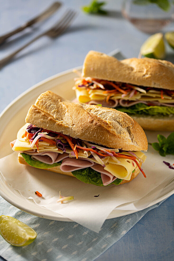 Baguette sandwich with ham, cheese and vegetables