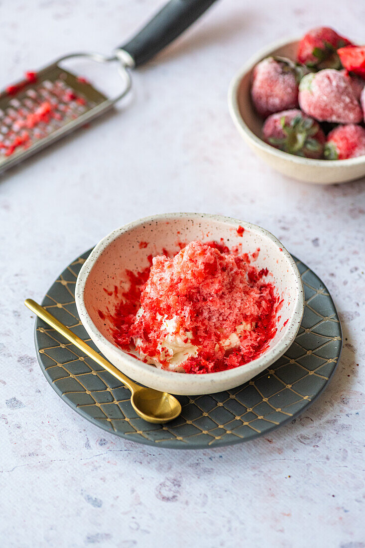 Grated frozen clementine on whipped cream