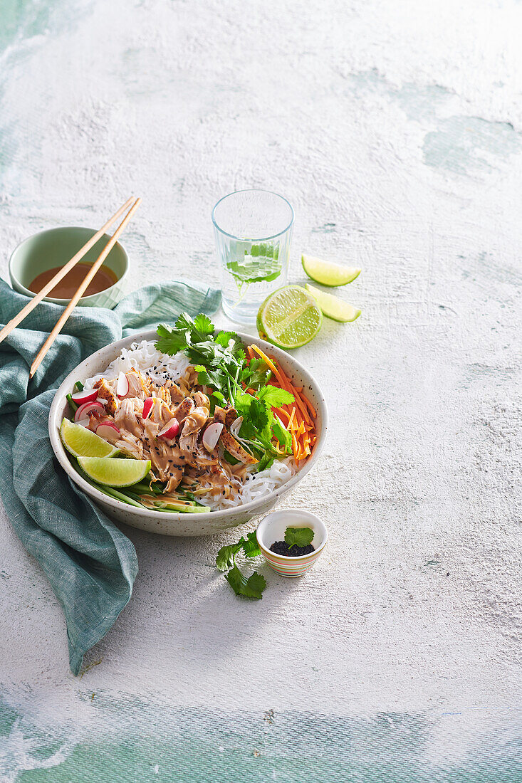 Asian noodle bowl with chicken and vegetables