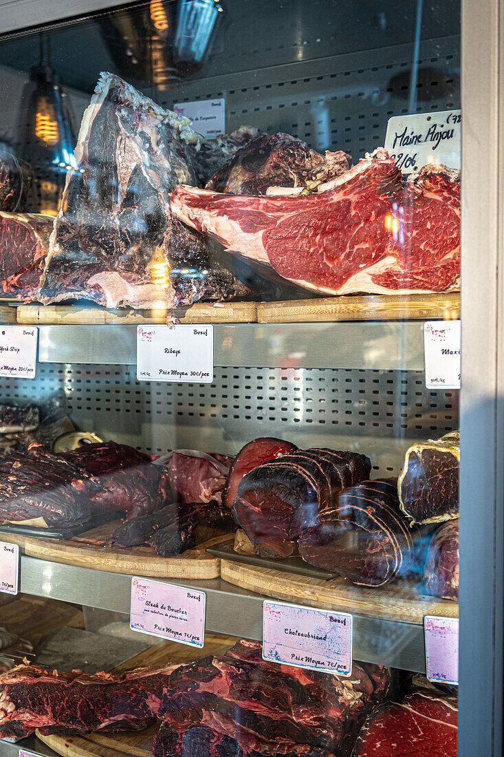 Charcuterie on display at a market in Brittany