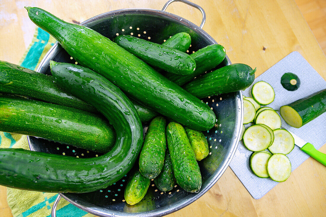 Different kinds of cucumbers in a sieve