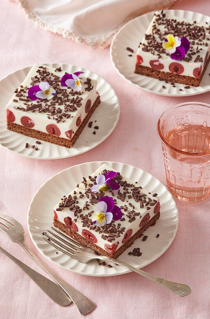 Coconut cake slices with almonds and cherries