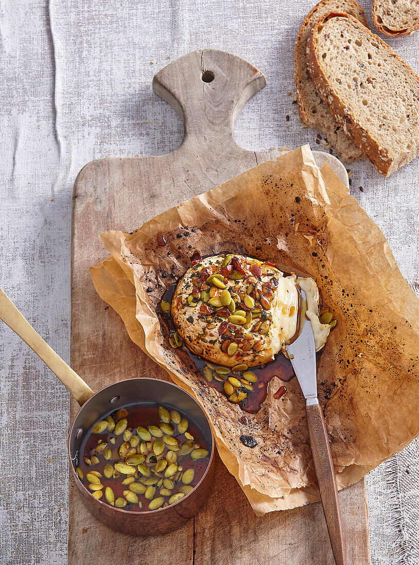 Grilled camembert with honey and pumpkin seeds