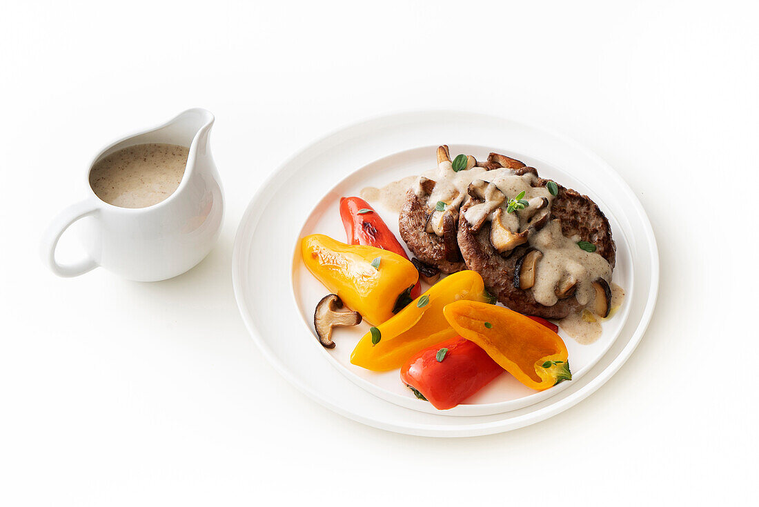 Meatballs with mushroom cream sauce and sweet peppers