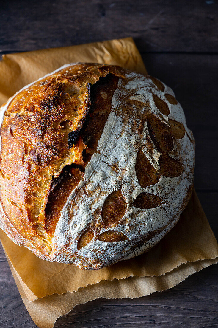 Homemade sourdough bread with decorative scoring
