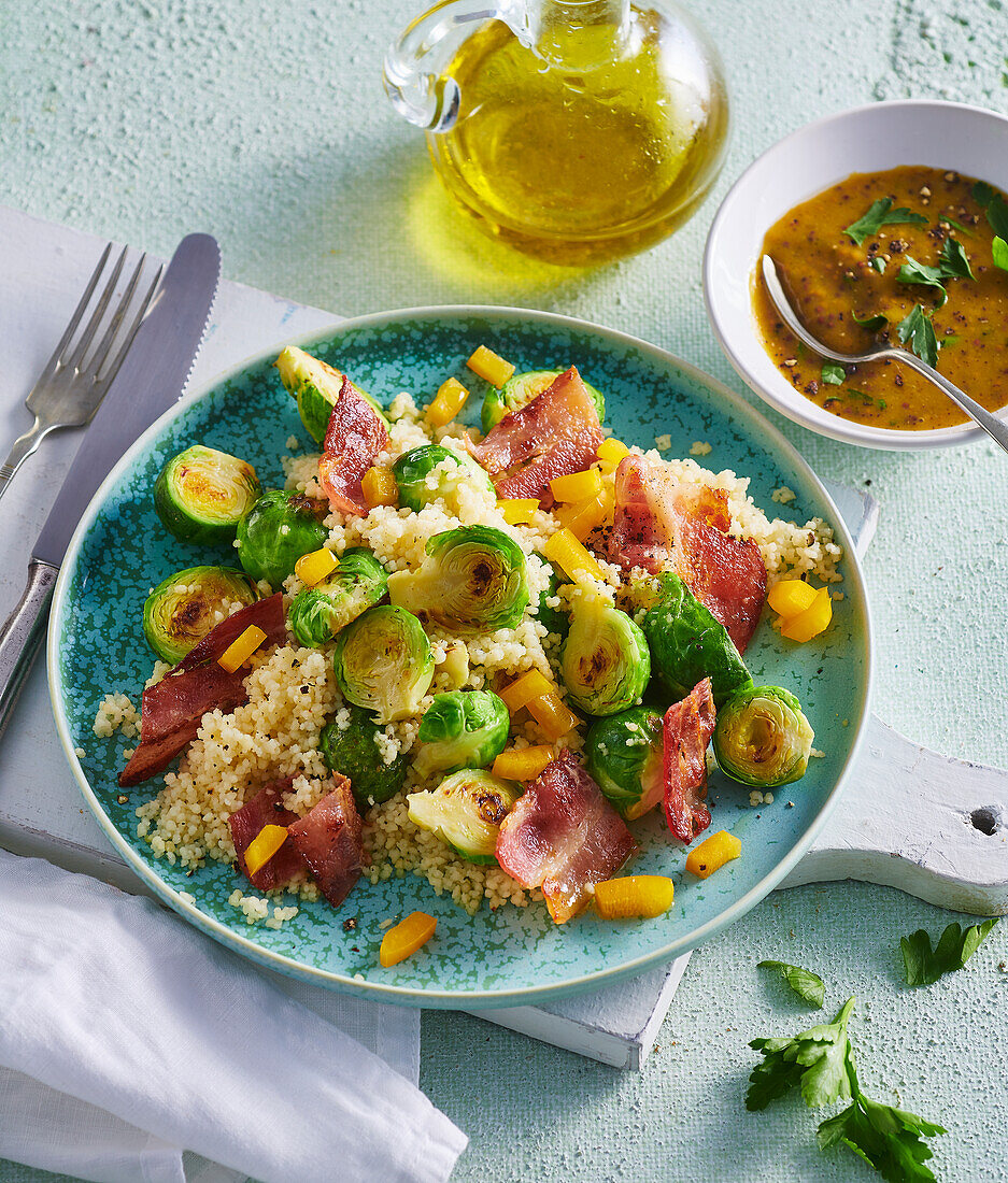 Warm couscous salad with bacon and Brussels sprouts
