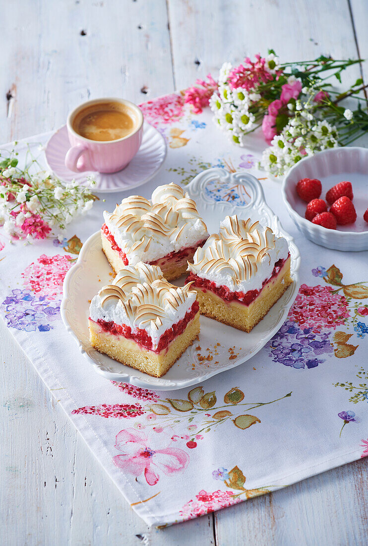 Raspberry cake slices with custard and meringue topping