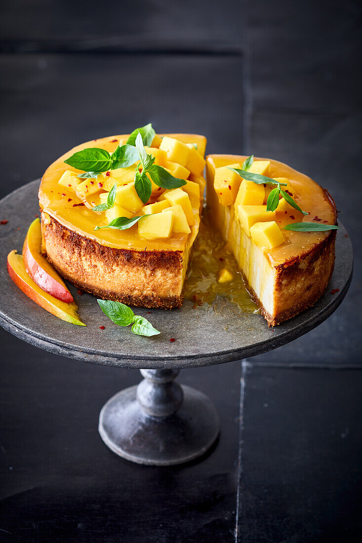 Yuzu cheesecake with mango, chilli flakes and Thai basil