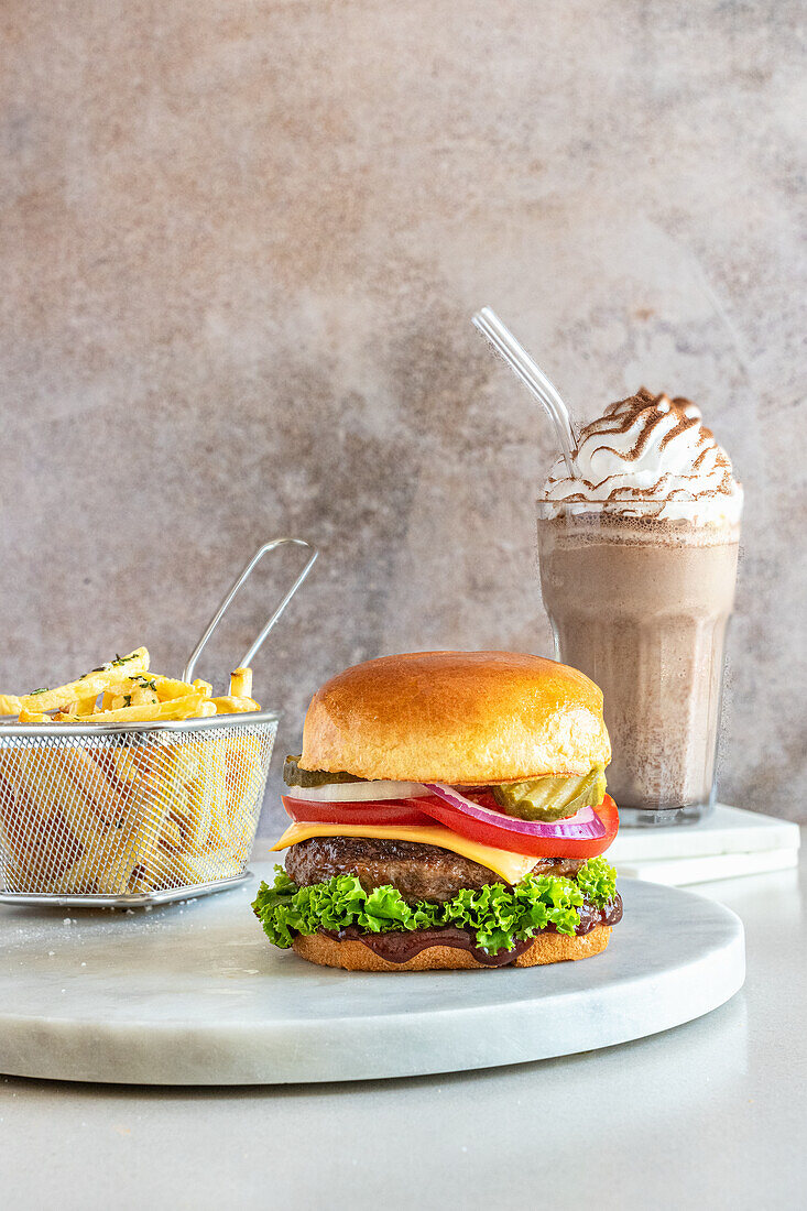 Beef burger with fries and milkshake i