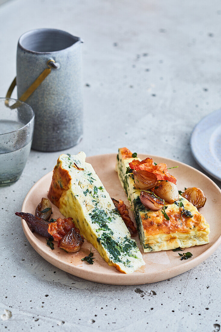 Spinach ricotta cake with balsamic onions and bacon