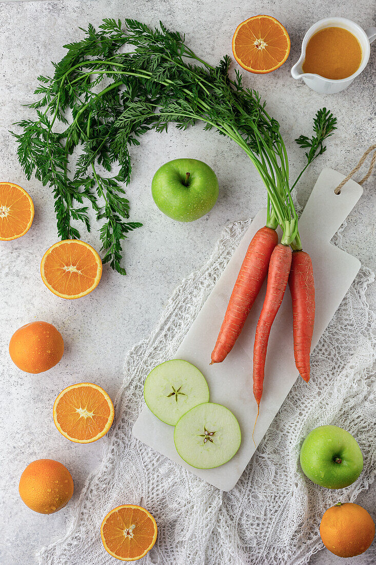 Carrots, apples, and oranges for a smoothie