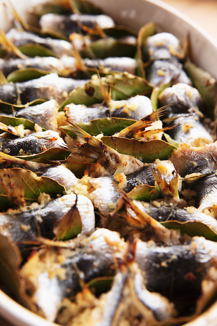 Stuffed sardines with pine nuts, golden raisins, and pecorino (Sicily)