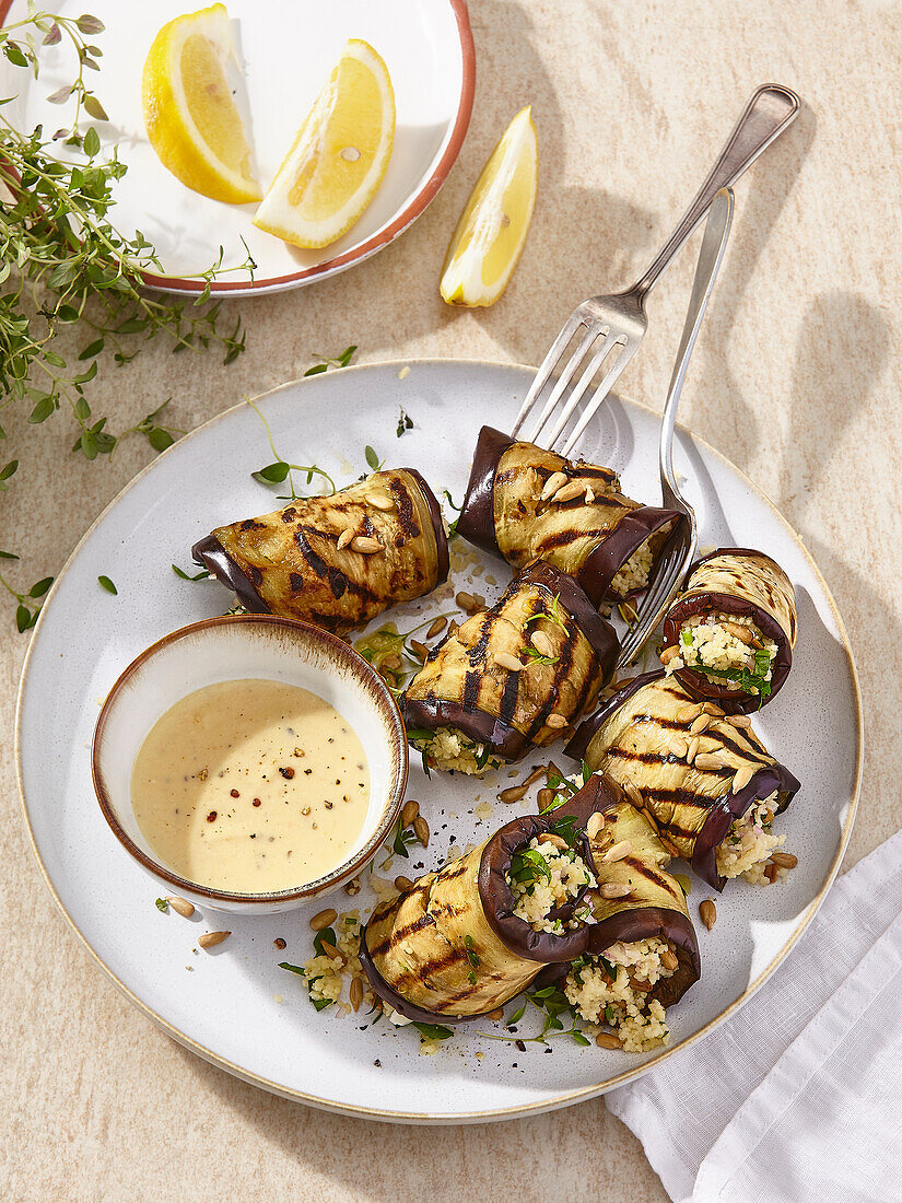 Grilled eggplant rolls filled with cauliflower rice and herbs