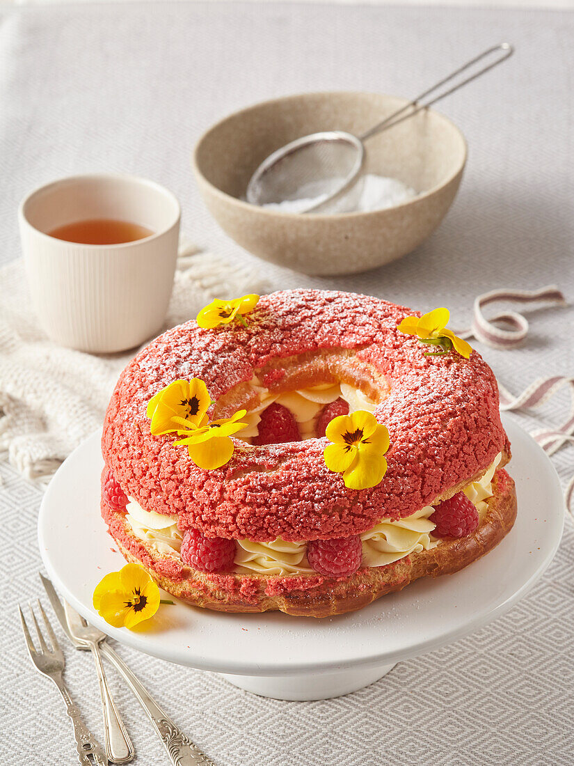 Large cream puff cake with raspberries