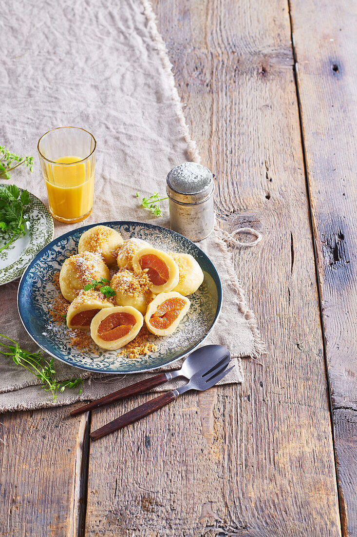 Apricot dumplings with walnut crumbs